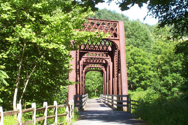 a metal bridge on trail