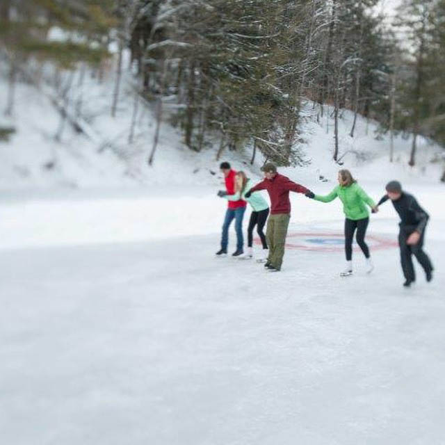 group of people skating on ice rink